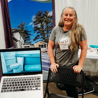 Julie poses at the WheelPad exhibitor booth during the Abilities Expo in Chicago, during June 21-23.