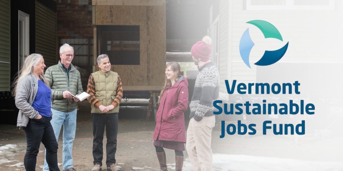 Julie Lineberger stands with Victor Morrison, business coach from the Vermont Sustainable Jobs Fund, and other members of the WheelPad L3C team at the early rendition of the manufacturing facility. 